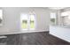 Open-concept living room featuring hardwood floors, and bright white paint at 609 Lobelia Way, Locust Grove, GA 30248