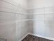 Walk-in pantry with multiple levels of wire shelving for storage and organization at 609 Lobelia Way, Locust Grove, GA 30248