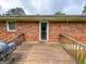 View from back deck looking to yard, brick house, and a glass door entry at 5141 Hiram Lithia Springs Rd, Powder Springs, GA 30127