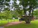 Basketball court in a backyard with a fenced-in area, offering recreational opportunities at 5141 Hiram Lithia Springs Rd, Powder Springs, GA 30127