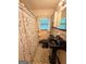 Vintage bathroom with black fixtures and black and white tile floors at 5141 Hiram Lithia Springs Rd, Powder Springs, GA 30127