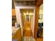 Hallway featuring hardwood floors with views of the kitchen and other rooms at 5141 Hiram Lithia Springs Rd, Powder Springs, GA 30127