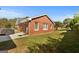 Spacious backyard, showcasing a well-maintained lawn and the rear exterior of the brick home at 120 Greenview Ter, Mcdonough, GA 30253