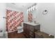Bathroom featuring dark wood vanity and colorful polka dot shower curtain at 120 Greenview Ter, Mcdonough, GA 30253