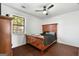 Bedroom with wood trim bed, ceiling fan, and hardwood floors at 120 Greenview Ter, Mcdonough, GA 30253