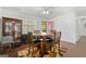 Lovely dining space featuring a wooden table set and decorative hutch at 120 Greenview Ter, Mcdonough, GA 30253
