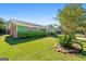 Landscaped lawn and a green exterior of this home featuring colorful shutters at 120 Greenview Ter, Mcdonough, GA 30253
