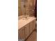 Bathroom featuring a white vanity with chrome hardware, a large mirror, and shelving at 7314 Basalt Dr, Union City, GA 30291