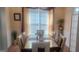 Elegant dining room with a glass-top table, stylish chairs, and decorative accents at 7314 Basalt Dr, Union City, GA 30291