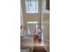 Bright foyer with hardwood floors, white door with sidelights and transom, and chandelier at 7314 Basalt Dr, Union City, GA 30291