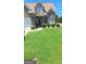 Charming two-story brick and stone home with a well-manicured lawn and inviting curb appeal at 7314 Basalt Dr, Union City, GA 30291