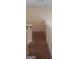 Upstairs hallway features neutral colored walls and carpet and has a view of the staircase at 7314 Basalt Dr, Union City, GA 30291