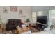 Well-lit living room with neutral tones, comfortable furniture, and a decorative area rug at 7314 Basalt Dr, Union City, GA 30291