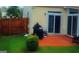 Backyard with a patio area including a grill and sliding glass doors at 7314 Basalt Dr, Union City, GA 30291