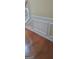 Detailed trim work along the staircase with beautiful hardwood floors at 7314 Basalt Dr, Union City, GA 30291