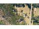 Aerial view showing the location and layout of the house, pool, and surrounding wooded area at 308 Lee Thompson Rd, Moreland, GA 30259