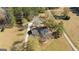 Aerial view of a home with a pool and detached outbuilding on a large lot with mature trees at 308 Lee Thompson Rd, Moreland, GA 30259