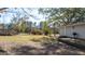 This angle of the home highlights a wooden deck and access to the backyard at 308 Lee Thompson Rd, Moreland, GA 30259