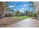 Backyard with a wooden deck, lawn, and covered lawn equipment at 308 Lee Thompson Rd, Moreland, GA 30259