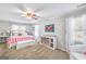 Bright bedroom features a ceiling fan, plush carpet and a double window for natural light at 308 Lee Thompson Rd, Moreland, GA 30259