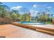 Wooden deck with a covered swimming pool at 308 Lee Thompson Rd, Moreland, GA 30259
