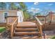 Wooden deck with stairs leading to an outdoor space at 308 Lee Thompson Rd, Moreland, GA 30259