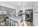 Modern kitchen with granite countertops, stainless steel appliances, and an island with seating at 308 Lee Thompson Rd, Moreland, GA 30259