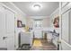 Spacious laundry room with modern washer and dryer, ample counter space, and natural light at 308 Lee Thompson Rd, Moreland, GA 30259