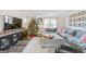 Comfortable living room with a festive Christmas tree and cozy decor at 308 Lee Thompson Rd, Moreland, GA 30259