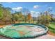 Covered pool on a wood deck, offering outdoor relaxation surrounded by lush greenery at 308 Lee Thompson Rd, Moreland, GA 30259