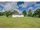 Large back yard with trees and green grass is perfect for or pets to play at 2809 South Ola Rd, Locust Grove, GA 30248