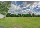 Wide open grass yard and mature trees provide privacy at 2809 South Ola Rd, Locust Grove, GA 30248
