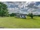 Charming single-story home featuring black shutters and a well-manicured lawn at 2809 South Ola Rd, Locust Grove, GA 30248