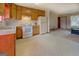 Bright kitchen features tile floors, ample cabinet storage, and white appliances at 2809 South Ola Rd, Locust Grove, GA 30248