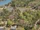 Aerial view of a lakefront community with mature trees and several homes on the shores of the lake at 2270 Emerald Dr, Jonesboro, GA 30236