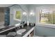 Bathroom with granite countertop, lake views, and updated fixtures at 2270 Emerald Dr, Jonesboro, GA 30236