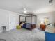 Spacious bedroom with a four-poster bed, soft carpet, and neutral wall paint at 2270 Emerald Dr, Jonesboro, GA 30236