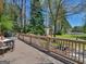 Exterior view from the deck showcasing outdoor seating and beautiful green lawn at 2270 Emerald Dr, Jonesboro, GA 30236