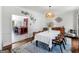 Bright dining room features a stylish light fixture, hardwood floors, and an open view to the gourmet kitchen at 2270 Emerald Dr, Jonesboro, GA 30236