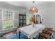 Charming dining space featuring a stylish light fixture, natural light, and an inviting atmosphere for gatherings at 2270 Emerald Dr, Jonesboro, GA 30236