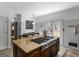 Spacious kitchen features a large island with a cooktop, granite countertops, and access to a deck at 2270 Emerald Dr, Jonesboro, GA 30236