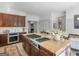Charming kitchen with custom cabinets, stainless steel appliances, granite counters, and an expansive island at 2270 Emerald Dr, Jonesboro, GA 30236