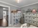 Spacious home office with ample storage, modern desk, carpeted floors, and neutral paint at 2270 Emerald Dr, Jonesboro, GA 30236