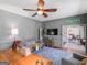 Office area with gray walls, a vintage Quaker State sign, and an open doorway to another room at 2270 Emerald Dr, Jonesboro, GA 30236