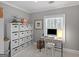 Well-organized home office featuring modern desk, a white storage cube, and natural light at 2270 Emerald Dr, Jonesboro, GA 30236