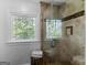Tiled shower with glass door, window, and natural light at 2270 Emerald Dr, Jonesboro, GA 30236