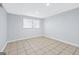 Basement area with tile floor and a window at 3210 Roseheath Ln, Lithonia, GA 30038