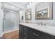 Bathroom featuring double vanity, marble countertop, and glass enclosed shower at 3210 Roseheath Ln, Lithonia, GA 30038