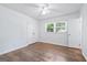 Bright bedroom features hardwood floors, ceiling fan, and a double door closet at 3210 Roseheath Ln, Lithonia, GA 30038