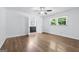 Bedroom with access to bathroom, hardwood flooring, and a ceiling fan at 3210 Roseheath Ln, Lithonia, GA 30038